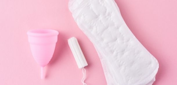 A menstrual cup, a tampon and a sanitary pad