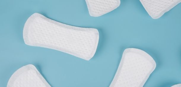White panty liners on a blue background.