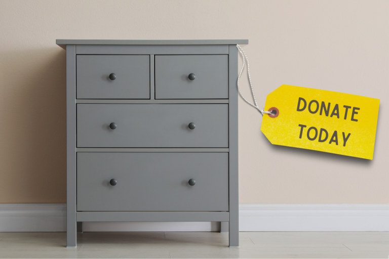 Chest of drawers with donate today label.