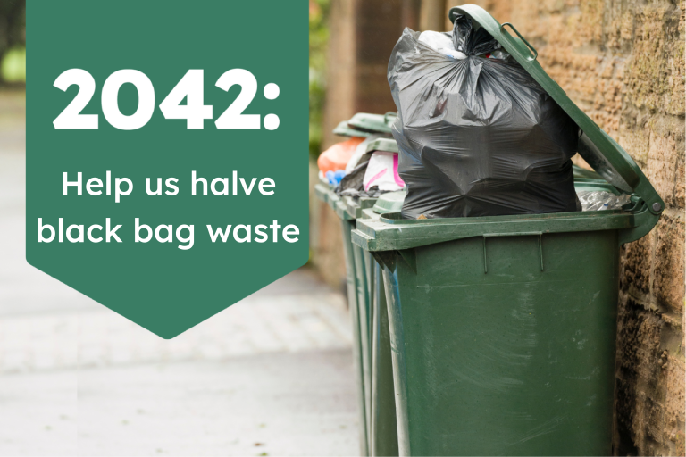 Wheeled residual waste overflowing with black sacks.
