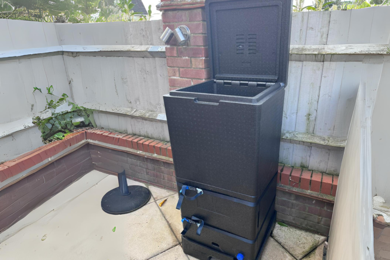 Hotbin compost bin in garden.