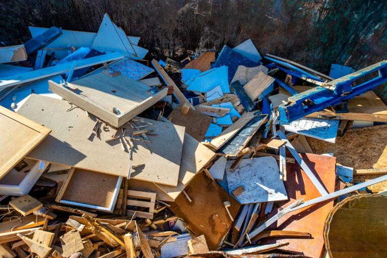 Wood in a container at a recycling centre.