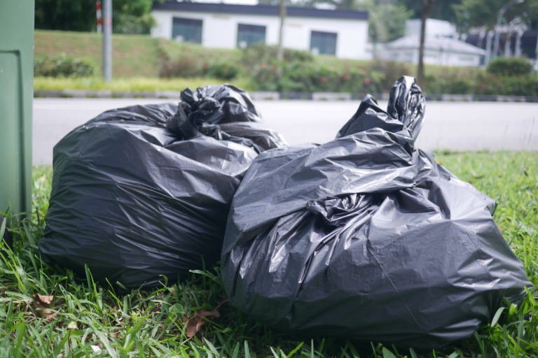 Two black bin bags of general rubbish.