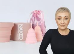 A photograph of a Unicorn Cup (menstrual cup) kit including a collapsable sterilizing pot, a cylindical shaped box, two diferent sized menstrual cups and a pink silk looking bag. The products are all neutral coloured. On the right is a photo of Julie Fyfe, the founder and owner of Unicorn Cup.